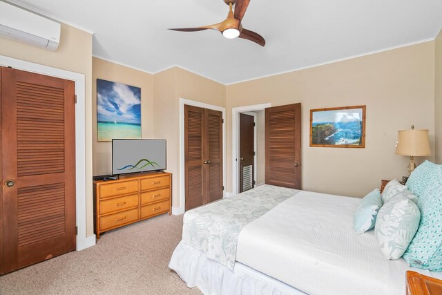2253 Poipu Rd Unit 207, Koloa, HI 96756 - bedroom with an AC wall unit, light carpet, two closets, ornamental molding, and a ceiling fan