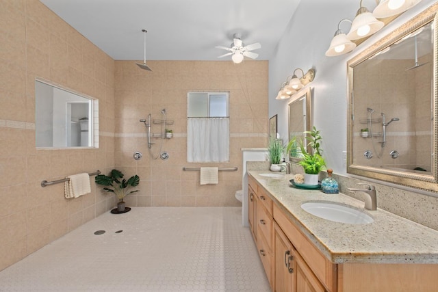 73-1125 Hamanamana St, Kailua-Kona, HI 96740 - full bath featuring tiled shower, a ceiling fan, vanity, toilet, and tile patterned flooring