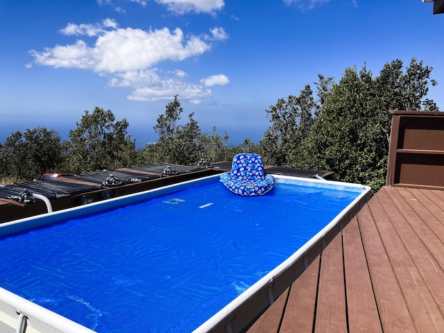 92-8744 Trade Wind Blvd, Ocean View, HI 96737 - view of swimming pool featuring a wooden deck