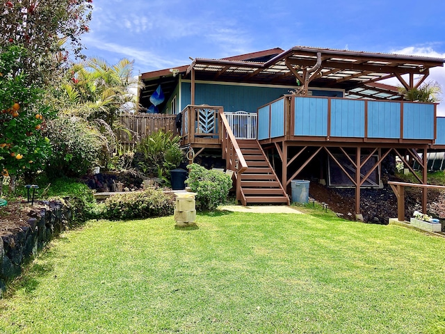 92-8744 Trade Wind Blvd, Ocean View, HI 96737 - rear view of house featuring a deck, a lawn, and stairway