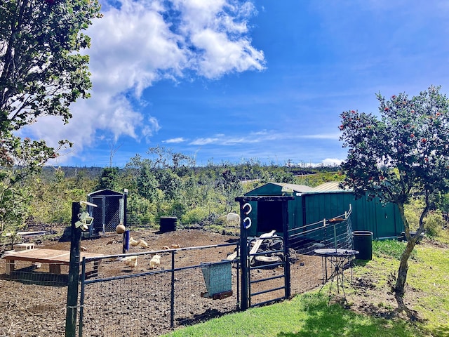 92-8744 Trade Wind Blvd, Ocean View, HI 96737 - view of yard with an outdoor structure