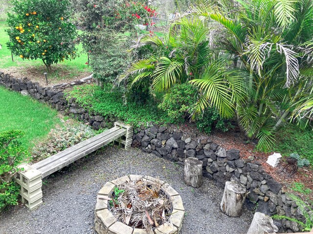 92-8744 Trade Wind Blvd, Ocean View, HI 96737 - view of yard with a fire pit