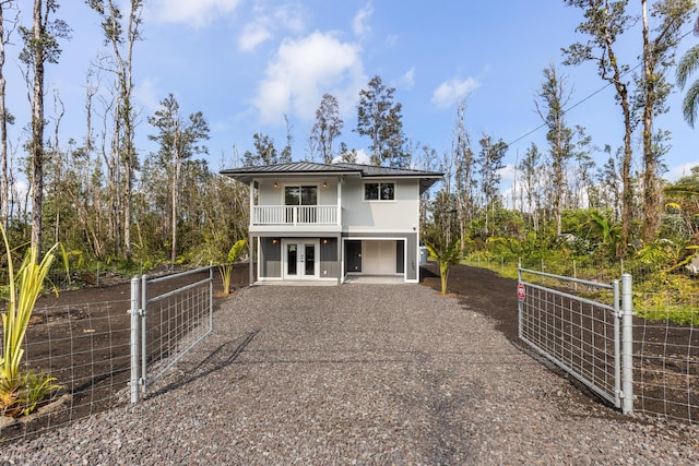 16-2097 Azure Dr, Pahoa, HI 96778 - view of front of home featuring driveway, a gate, french doors, and metal roof