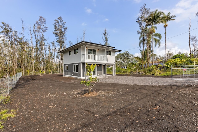 16-2097 Azure Dr, Pahoa, HI 96778 - view of front of house featuring a balcony and dirt driveway