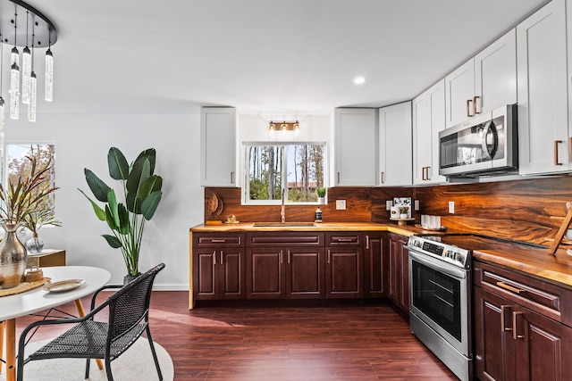 16-2097 Azure Dr, Pahoa, HI 96778 - kitchen featuring stainless steel appliances, a sink, wood counters, recessed lighting, and backsplash