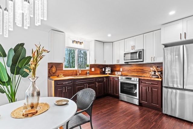 16-2097 Azure Dr, Pahoa, HI 96778 - kitchen featuring stainless steel appliances, a sink, light countertops, white cabinetry, and recessed lighting