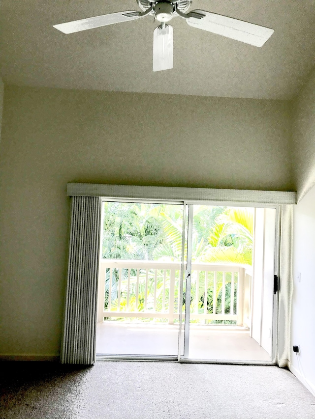 1831 Poipu Rd Unit 324, Koloa, HI 96756 - spare room featuring healthy amount of natural light, carpet floors, a ceiling fan, and baseboards