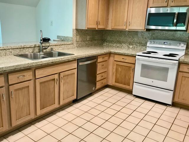 1831 Poipu Rd Unit 324, Koloa, HI 96756 - kitchen with stainless steel appliances, a sink, and light brown cabinetry