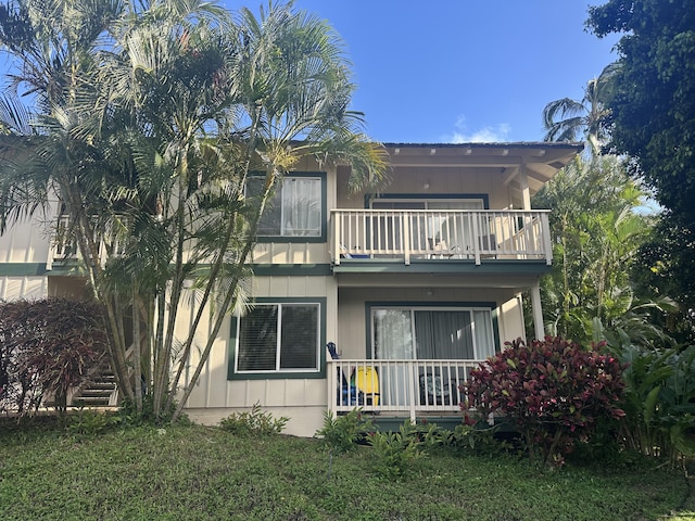 1831 Poipu Rd Unit 324, Koloa, HI 96756 - back of house featuring a balcony and covered porch