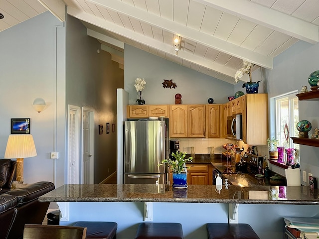 92-8414 Bamboo Ln, Ocean View, HI 96737 - kitchen with appliances with stainless steel finishes, wood ceiling with exposed beams, a kitchen bar, a peninsula, and high vaulted ceiling