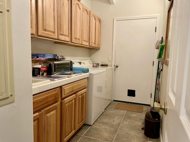 92-8414 Bamboo Ln, Ocean View, HI 96737 - laundry room with cabinet space, washing machine and clothes dryer, and tile patterned flooring