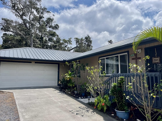 92-8414 Bamboo Ln, Ocean View, HI 96737 - ranch-style home featuring concrete driveway, a garage, and metal roof