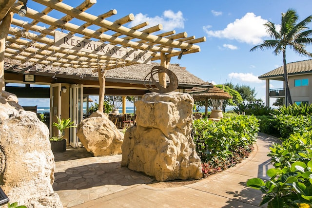 4-820 Kuhio Hwy Unit A101, Kapaa, HI 96746 - view of patio / terrace featuring a pergola