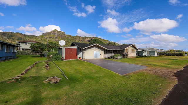 267 Hookipa Rd, Kapaa, HI 96746 - single story home featuring driveway, a mountain view, and a front yard