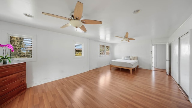 267 Hookipa Rd, Kapaa, HI 96746 - bedroom featuring multiple windows, light wood-style flooring, and a ceiling fan