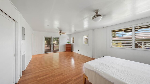 267 Hookipa Rd, Kapaa, HI 96746 - bedroom featuring access to outside, light wood-type flooring, a ceiling fan, and baseboards