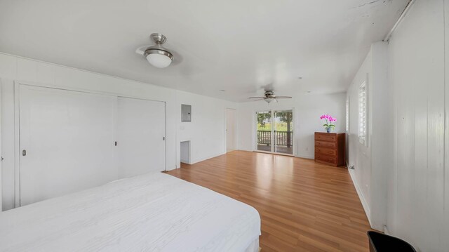 267 Hookipa Rd, Kapaa, HI 96746 - bedroom featuring wood finished floors, access to outside, electric panel, a closet, and baseboards
