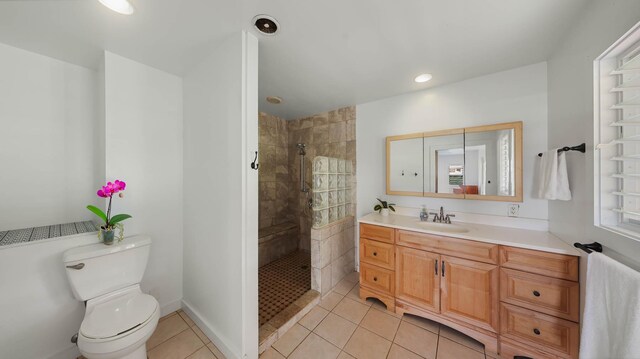 267 Hookipa Rd, Kapaa, HI 96746 - bathroom featuring toilet, vanity, tile patterned flooring, tiled shower, and recessed lighting