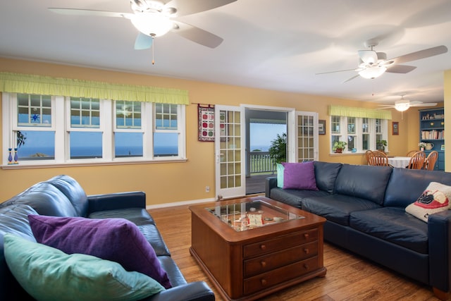 54-2319 Kynnersley Rd, Kapaau, HI 96755 - living area with ceiling fan, wood finished floors, and baseboards