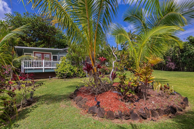 5-7330 Kuhio Hwy Unit B, Hanalei, HI 96714 - view of green lawn with a wooden deck