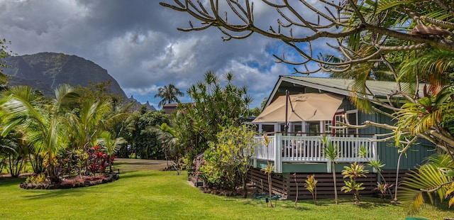 5-7330 Kuhio Hwy Unit B, Hanalei, HI 96714 - view of green lawn featuring a deck with mountain view
