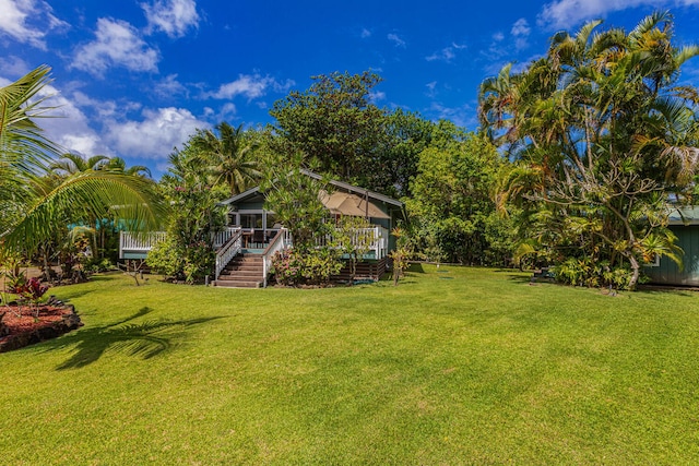5-7330 Kuhio Hwy Unit B, Hanalei, HI 96714 - view of green lawn featuring stairs