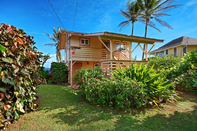 4934 Aliomanu Rd, Anahola, HI 96703 - rear view of house featuring a lawn