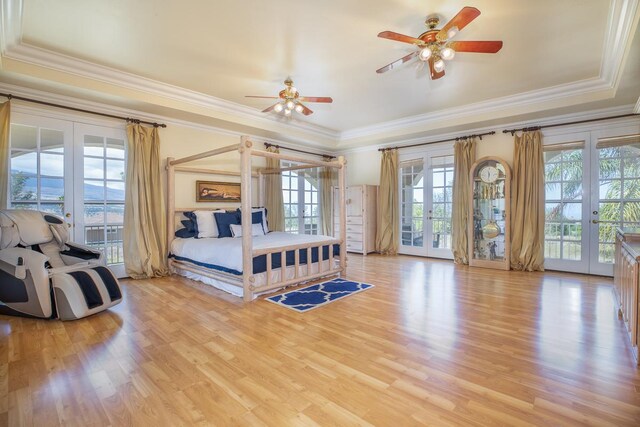 71-1714 Puu Napoo Dr, Kailua-Kona, HI 96740 - bedroom with french doors, ornamental molding, light wood-style flooring, access to exterior, and a raised ceiling