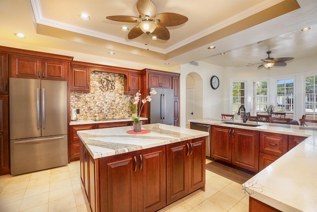 71-1714 Puu Napoo Dr, Kailua-Kona, HI 96740 - kitchen featuring appliances with stainless steel finishes, a sink, ceiling fan, a center island, and a tray ceiling