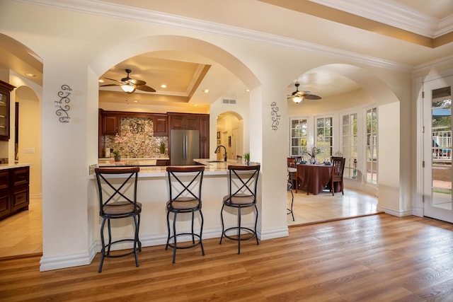 71-1714 Puu Napoo Dr, Kailua-Kona, HI 96740 - kitchen featuring freestanding refrigerator, a ceiling fan, a kitchen breakfast bar, a sink, and ornamental molding