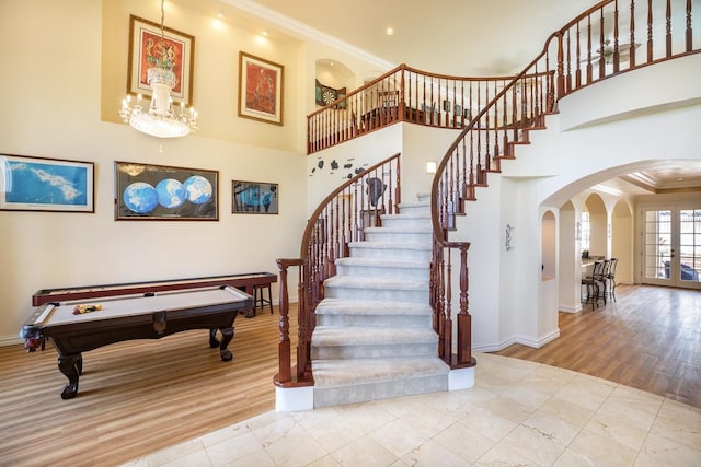 71-1714 Puu Napoo Dr, Kailua-Kona, HI 96740 - staircase with arched walkways, baseboards, ornamental molding, billiards table, and a towering ceiling