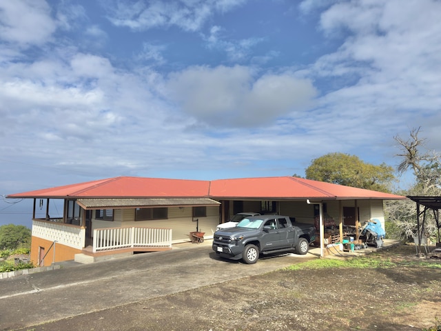 82-1091 Kinue Rd, Captain Cook, HI 96704 - view of front of home with driveway, metal roof, and a garage