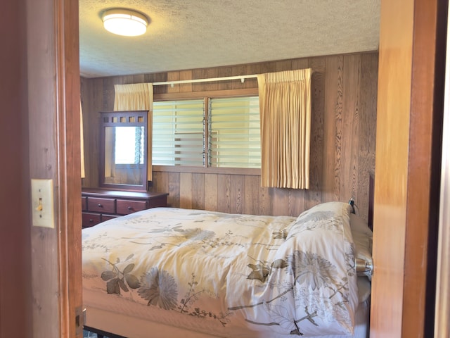 82-1091 Kinue Rd, Captain Cook, HI 96704 - bedroom featuring wooden walls and a textured ceiling