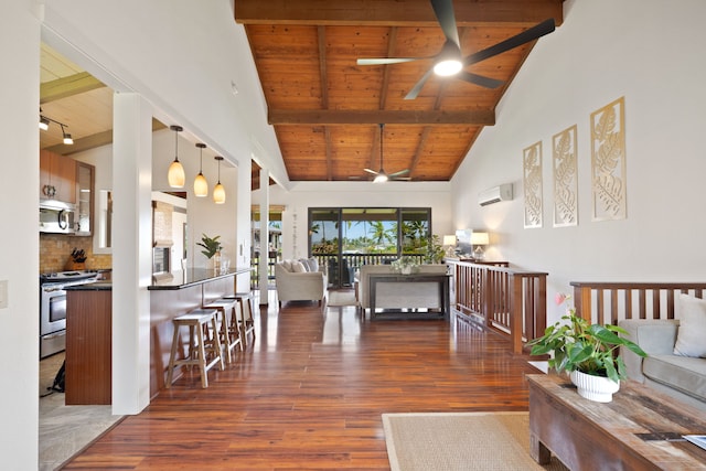1870 Hoone Rd Unit 600, Koloa, HI 96756 - living room with ceiling fan, wooden ceiling with exposed beams, wood finished floors, an AC wall unit, and high vaulted ceiling