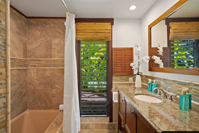 1870 Hoone Rd Unit 600, Koloa, HI 96756 - bathroom featuring vanity, shower / bath combo with shower curtain, backsplash, recessed lighting, and plenty of natural light