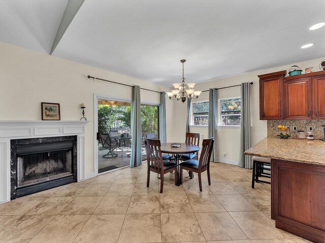 71-1371 Puu Kamanu Ln, Kailua-Kona, HI 96740 - dining area with a chandelier, a fireplace, recessed lighting, and baseboards