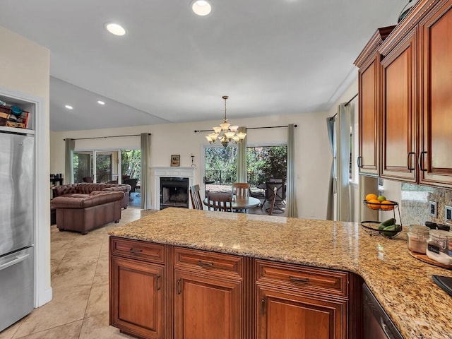 71-1371 Puu Kamanu Ln, Kailua-Kona, HI 96740 - kitchen with freestanding refrigerator, a peninsula, a chandelier, light stone countertops, and healthy amount of natural light