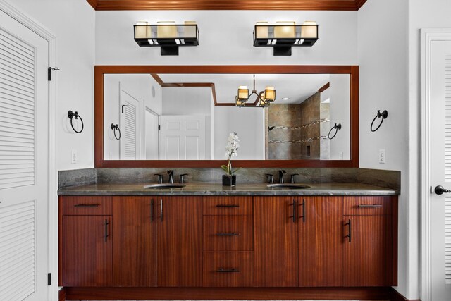 15-1594 22nd Ave, Keaau, HI 96749 - bathroom with double vanity, crown molding, and a chandelier