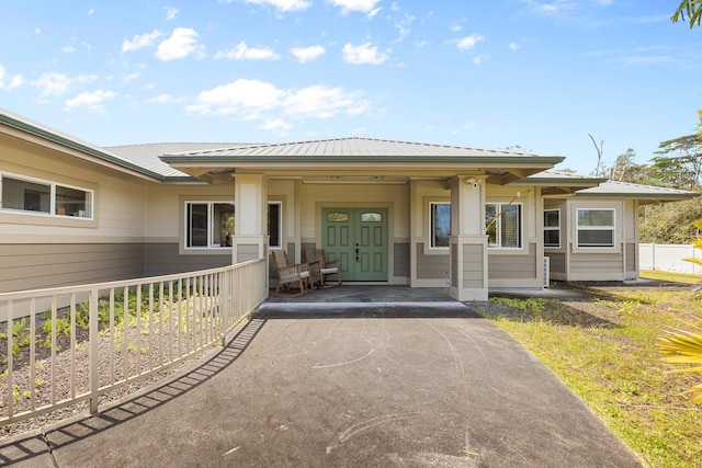 15-1594 22nd Ave, Keaau, HI 96749 - entrance to property featuring asphalt driveway, metal roof, and a porch