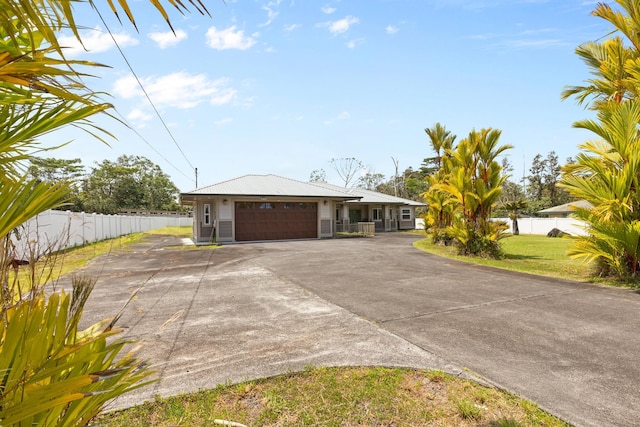 15-1594 22nd Ave, Keaau, HI 96749 - view of front of property featuring driveway, a garage, and metal roof