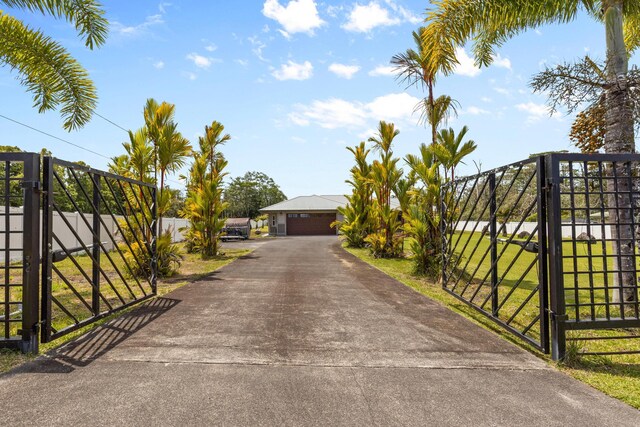 15-1594 22nd Ave, Keaau, HI 96749 - view of front of property featuring a gate and a garage