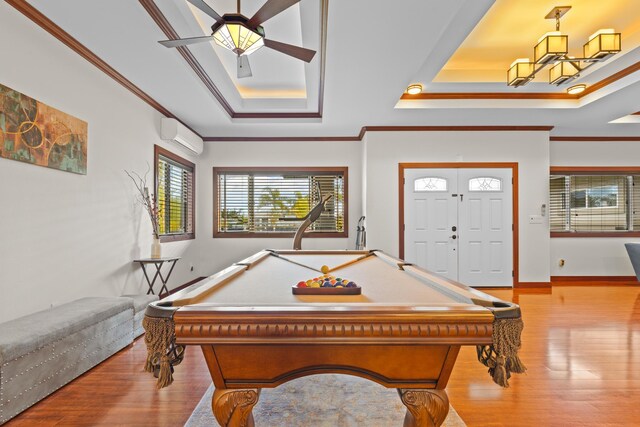 15-1594 22nd Ave, Keaau, HI 96749 - recreation room featuring a raised ceiling, wood finished floors, crown molding, a ceiling fan, and a wall mounted AC
