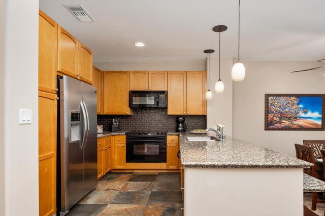 69-555 Waikoloa Beach Dr Unit 2604, Waikoloa, HI 96738 - kitchen featuring black appliances, a peninsula, a sink, decorative backsplash, and light stone counters