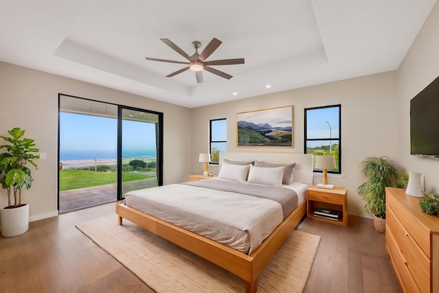 73-4493 Aloha Pl, Kailua-Kona, HI 96740 - bedroom featuring a raised ceiling, access to outside, light wood-style floors, recessed lighting, and ceiling fan