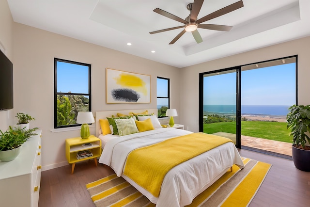 73-4493 Aloha Pl, Kailua-Kona, HI 96740 - bedroom featuring a tray ceiling, multiple windows, access to exterior, and recessed lighting