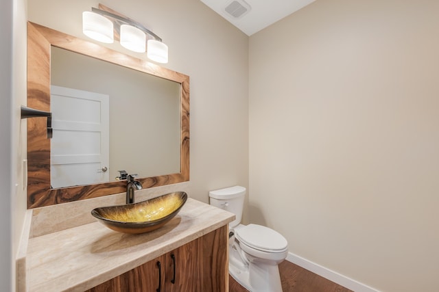 73-4493 Aloha Pl, Kailua-Kona, HI 96740 - half bathroom featuring vanity and wood finished floors