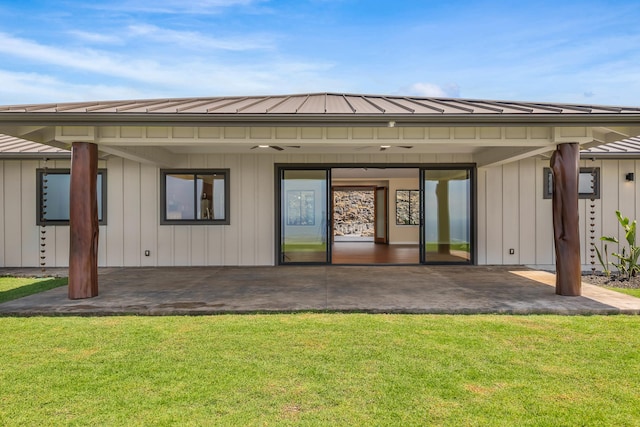 73-4493 Aloha Pl, Kailua-Kona, HI 96740 - back of house featuring a patio area, a yard, a metal roof, board and batten siding, and a standing seam roof