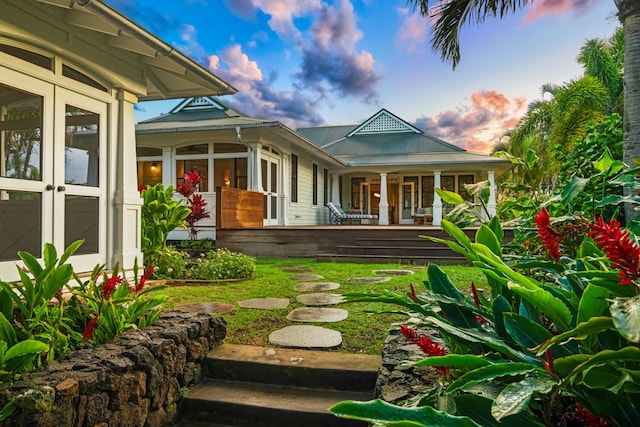 2640 Uluwehi St, Koloa, HI 96756 - rear view of house with covered porch and metal roof