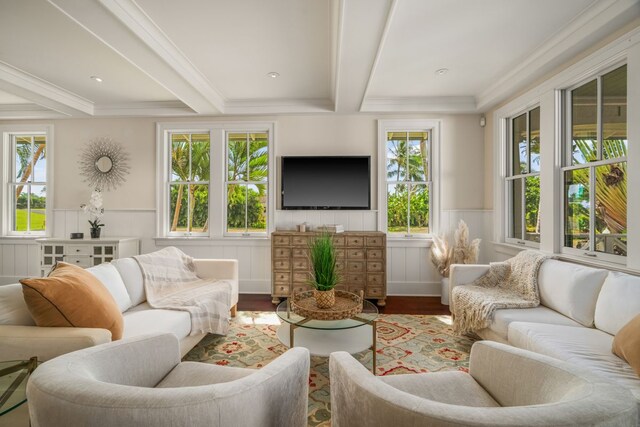 2640 Uluwehi St, Koloa, HI 96756 - living area featuring wood finished floors, beam ceiling, a wainscoted wall, and ornamental molding