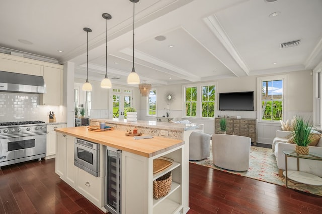 2640 Uluwehi St, Koloa, HI 96756 - kitchen with appliances with stainless steel finishes, wine cooler, open floor plan, dark wood-style floors, and ornamental molding